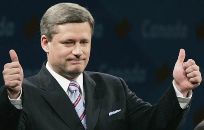 Canada's Harper staves off defeat; Conservatives charge treason